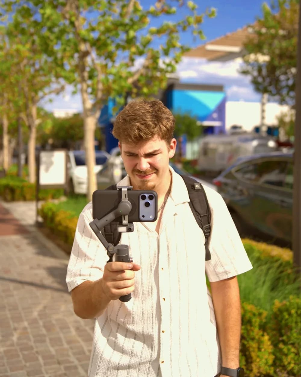 Ryan filming with a phone on a gimbal