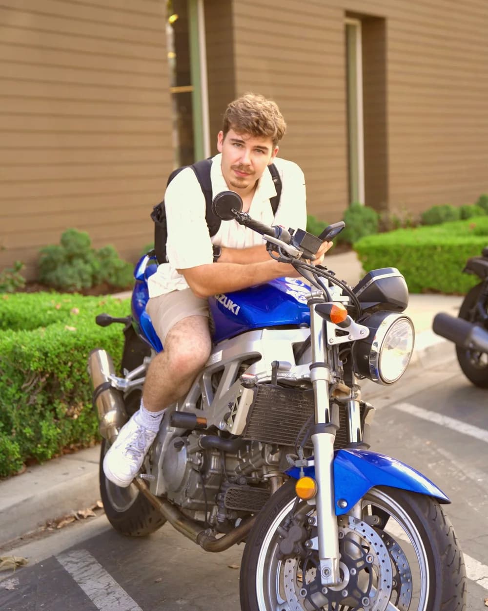 Ryan on his blue Suzuki